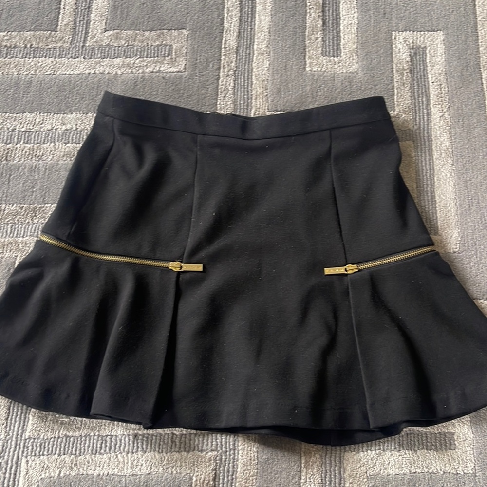 Michael Kors size 4 black skirt with gold zipper details. Worn once